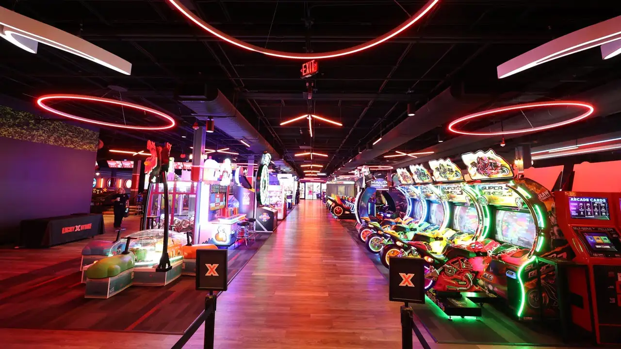 Huge, colorful arcade games in a beautiful arcade room.