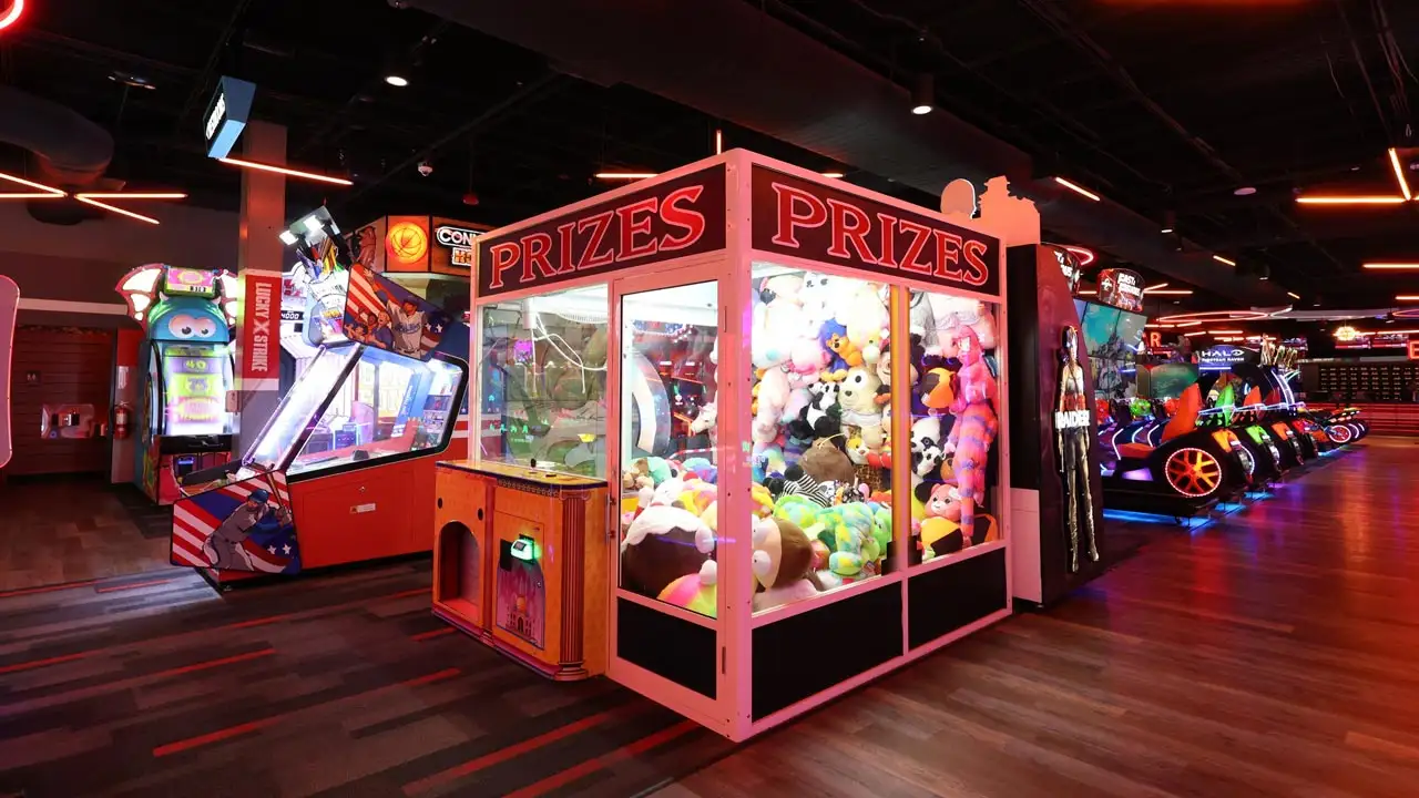 Large and colorful arcade games in a beautiful arcade room.