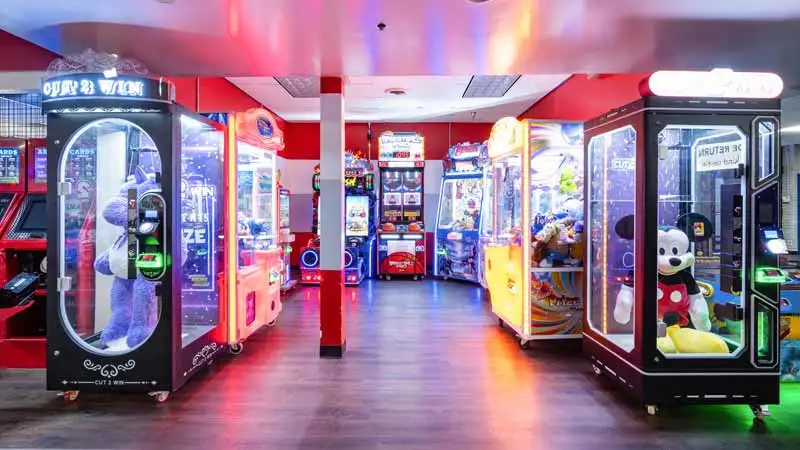 Large and colorful arcade games in a beautiful arcade room.