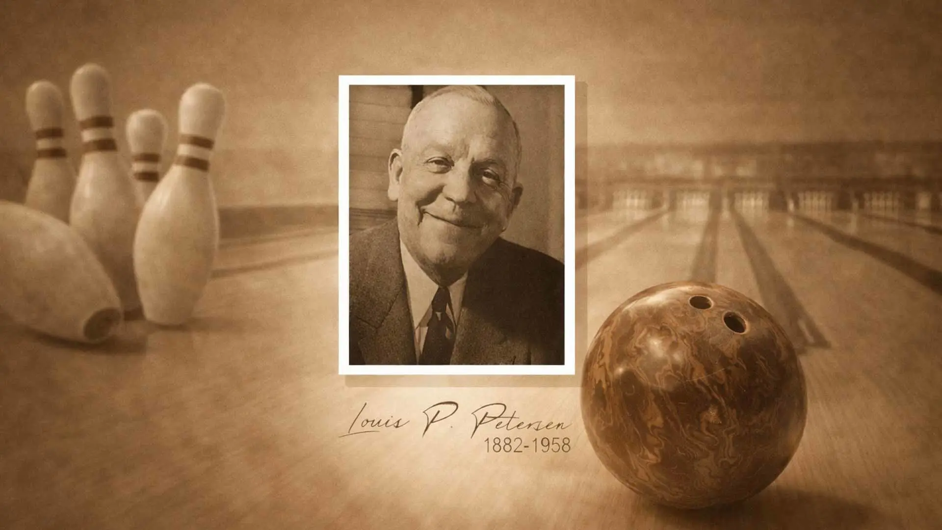 Black and white image of Petersen wearing a suit and tie