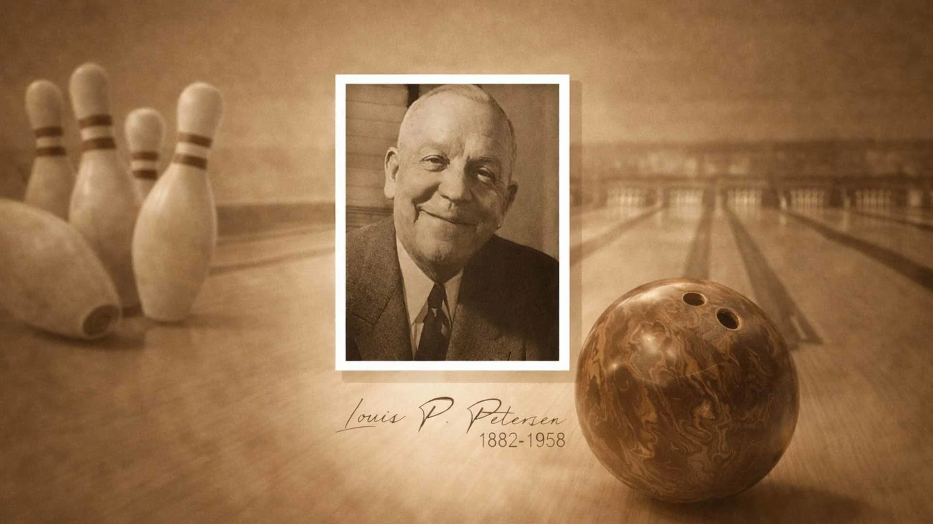 Black and white image of Petersen wearing a suit and tie
