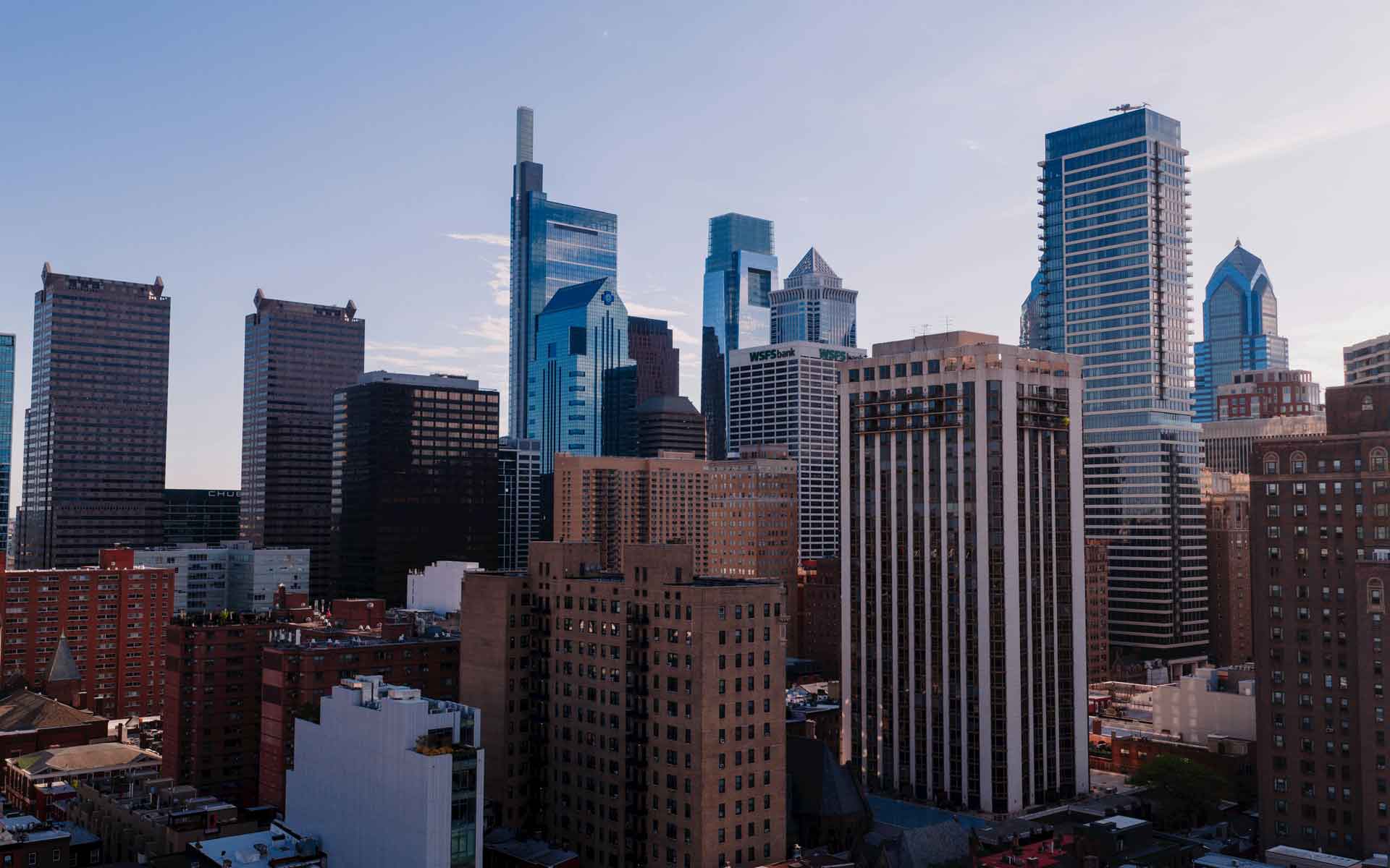 Philadelphia skyline at sunset with Center City skyscrapers and modern downtown architecture.