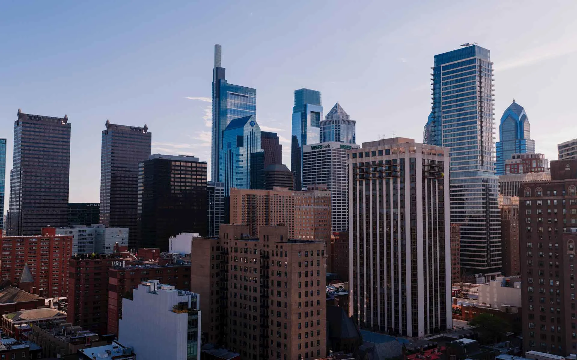 Philadelphia skyline at sunset with Center City skyscrapers and modern downtown architecture.