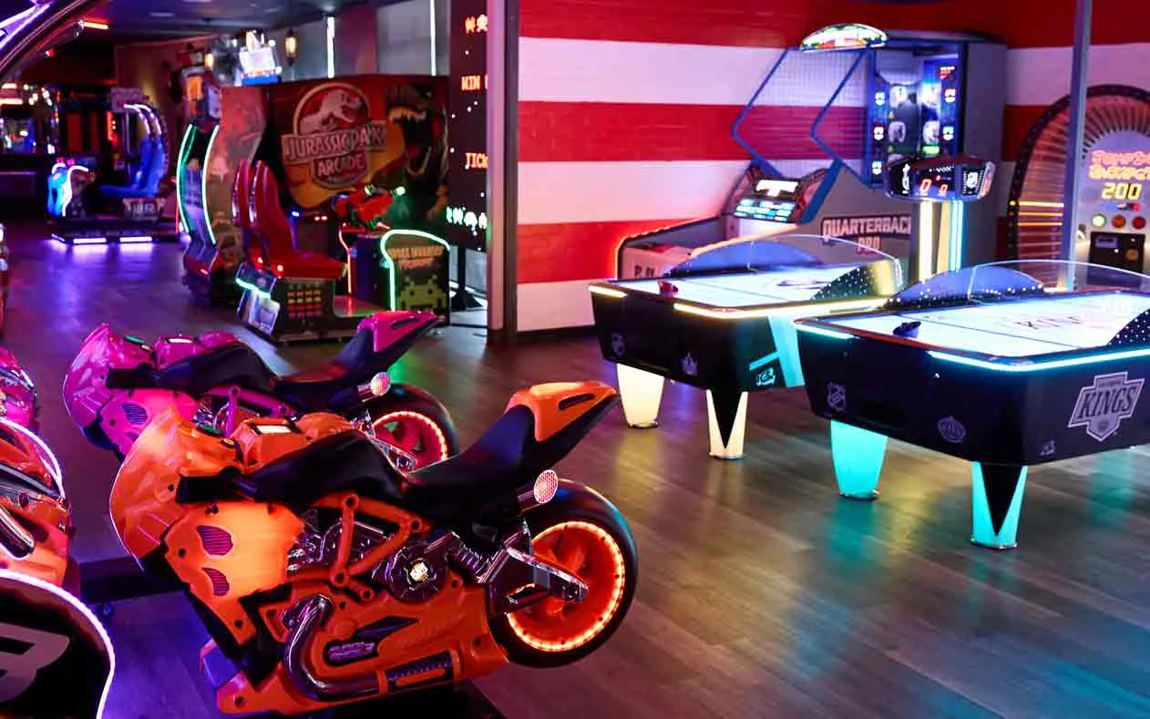 Air hockey table and motorcycle arcade games including Jurassic Park and Super Bikes at Lucky Strike Los Angeles