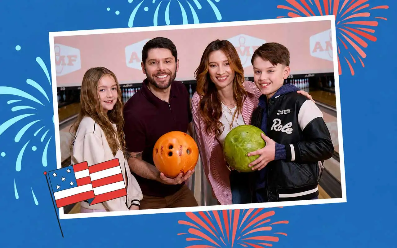 Family of four smiling at an AMF bowling alley during a Fourth of July celebration, holding colorful bowling balls in a patriotic photo frame with fireworks and an American flag illustration on a blue background.