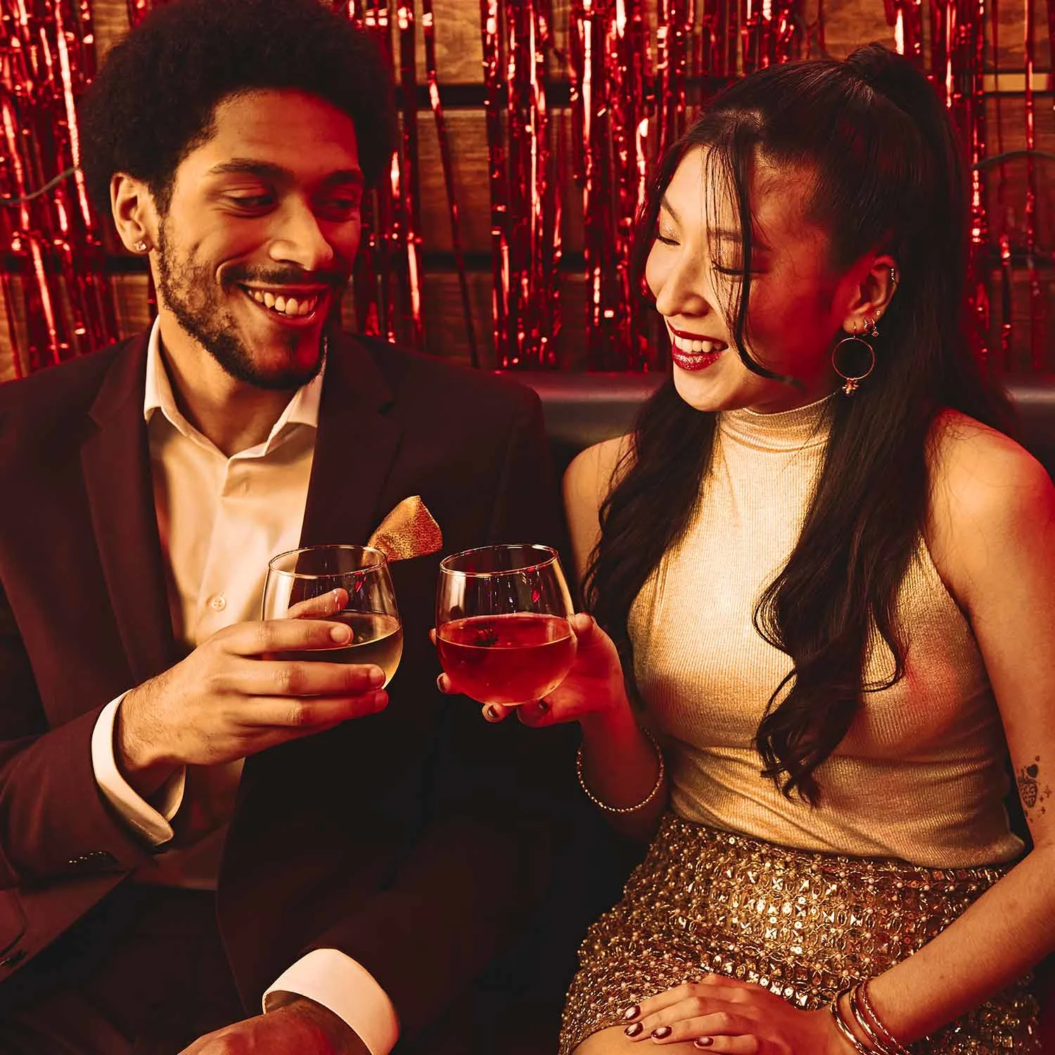 Coworkers toasting drinks at Lucky Strike event.