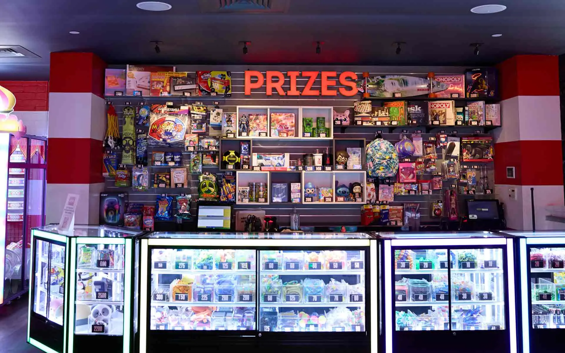 Arcade prize redemption counter with toys, games, and ticket displays at Lucky Strike Los Angeles
