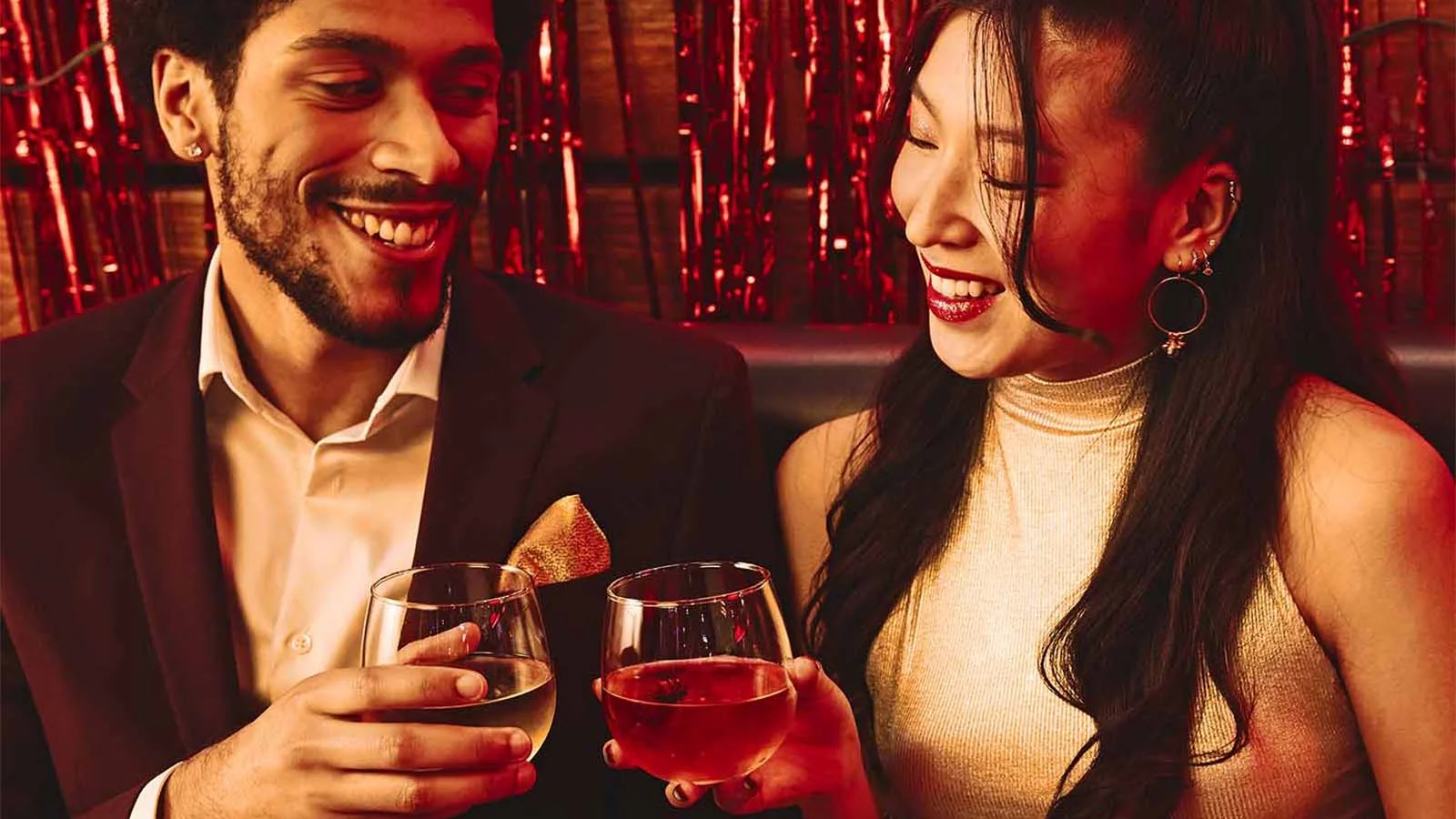 Coworkers toasting drinks at Lucky Strike event.