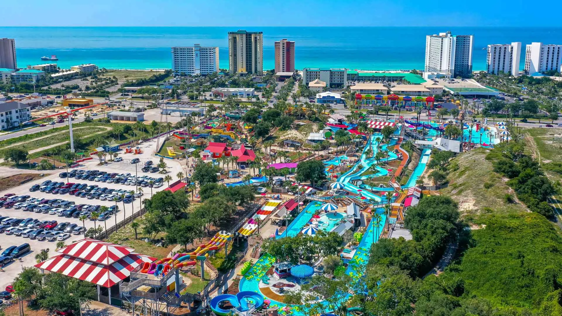 Aerial view of Big Kahuna’s Water & Adventure Park in Destin, Florida, featuring slides, pools, and attractions near the beach.