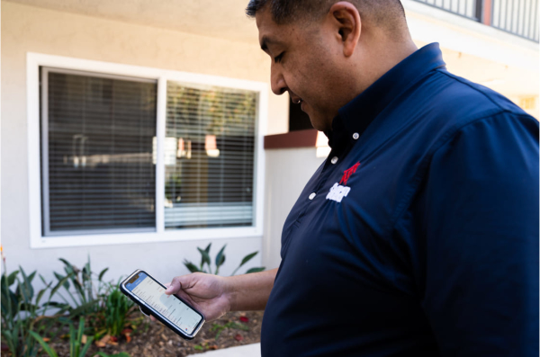 Home service pro using a cell phone to create estimates.
