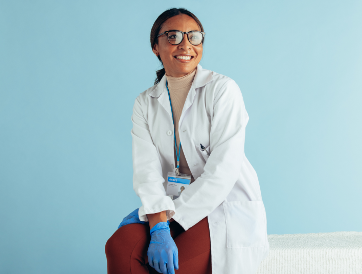 Sitting woman wearing glasses with a smile