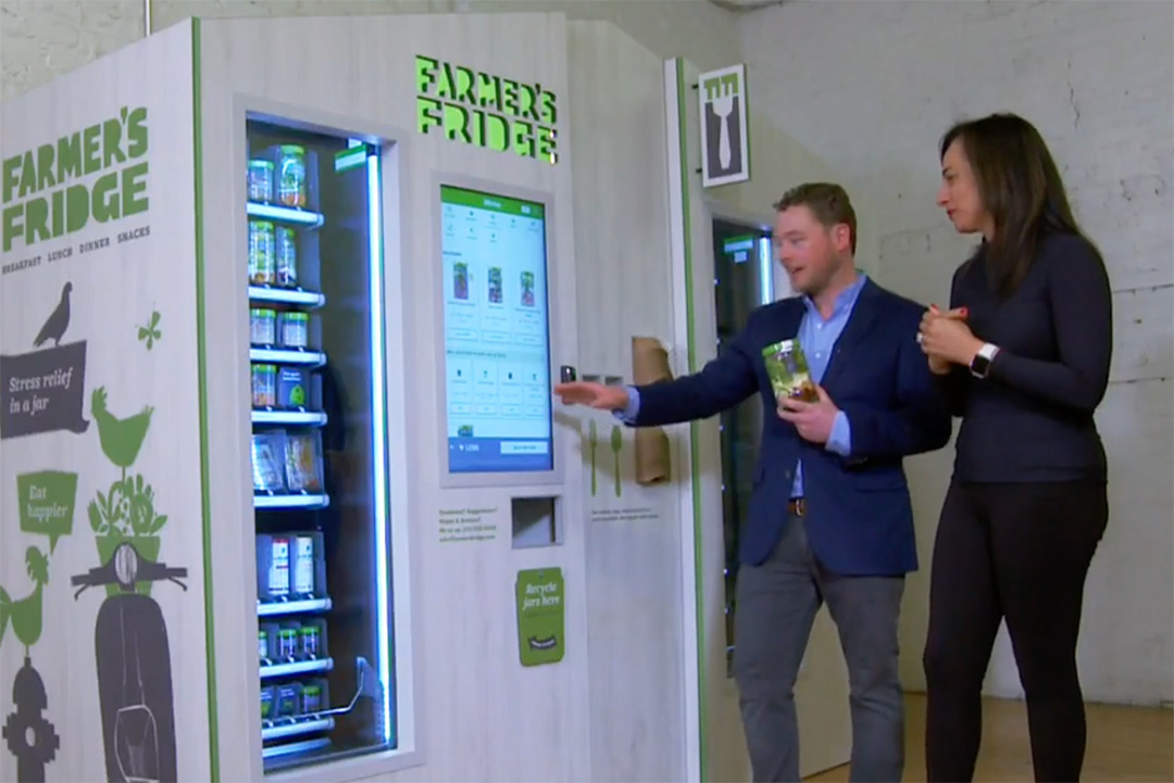 Farmer's Fridge CEO, Luke Saunders, explaining how to use the Fridge touchscreen.