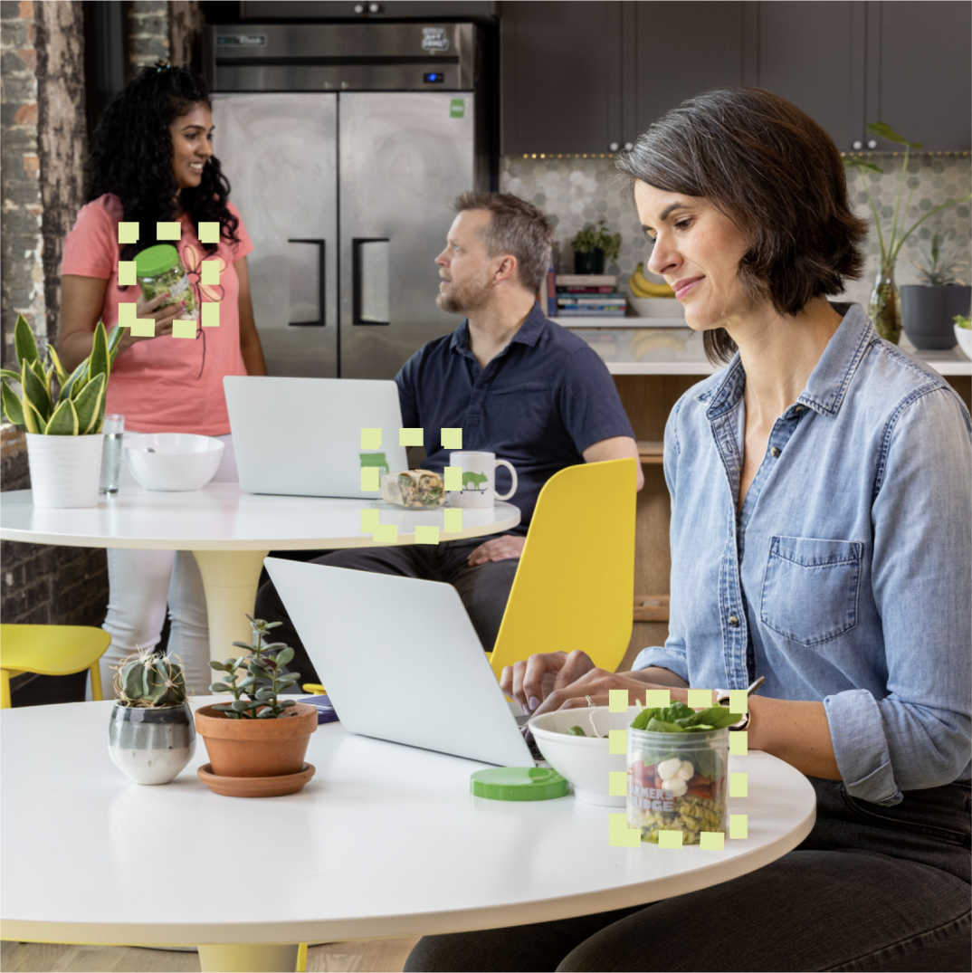 People with Farmer's Fridge jars at the office