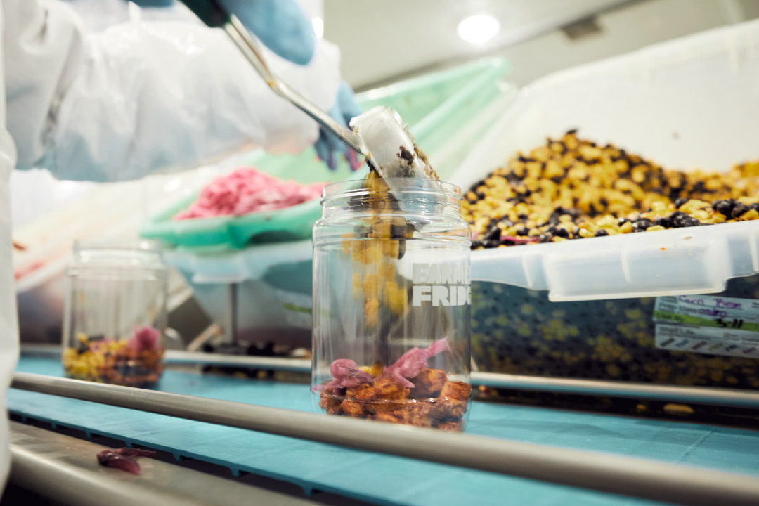 A Farmer's Fridge salad being made in our facility. 