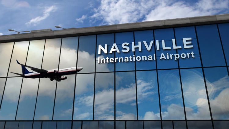 The outside of a building with a sign reading "Nashville International Airport"