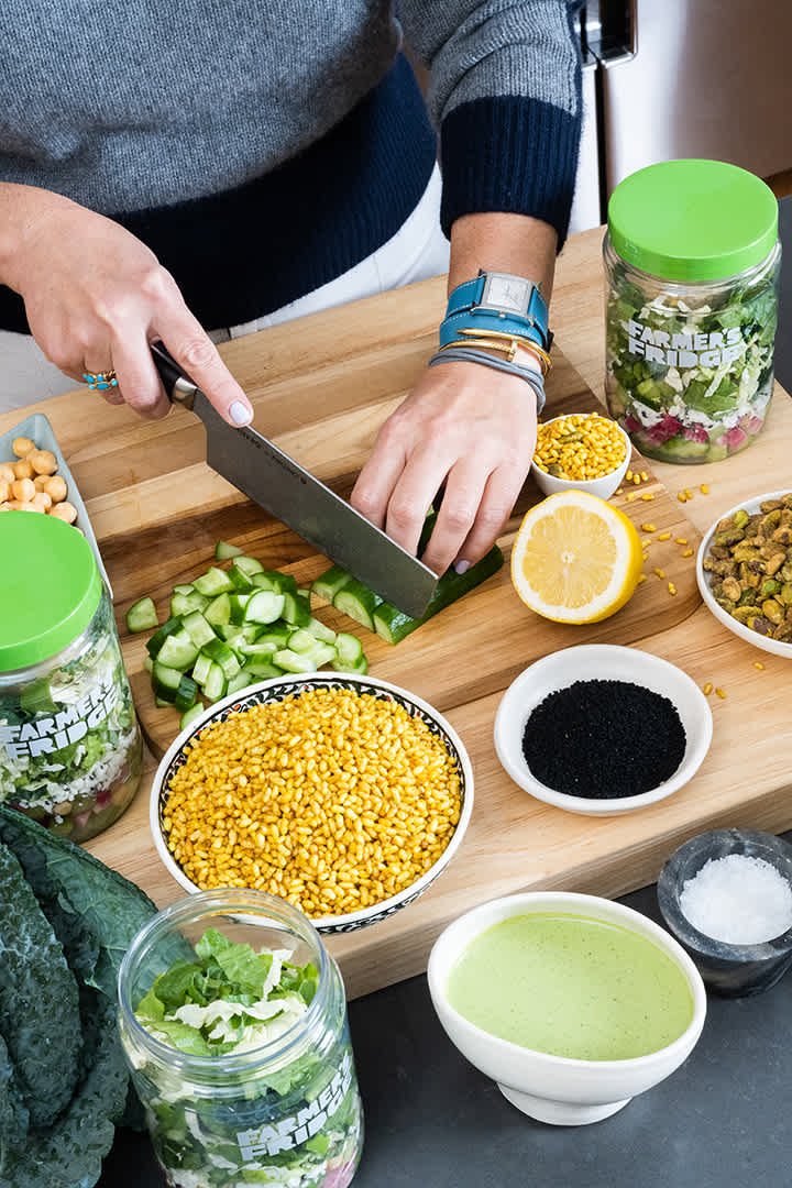 Image of Nilou chopping ingredients.