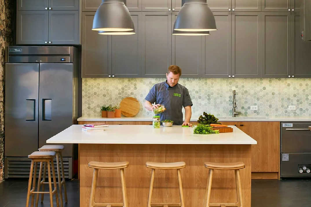 A photo of Farmer's Fridge head chef Kyle working in the test kitchen