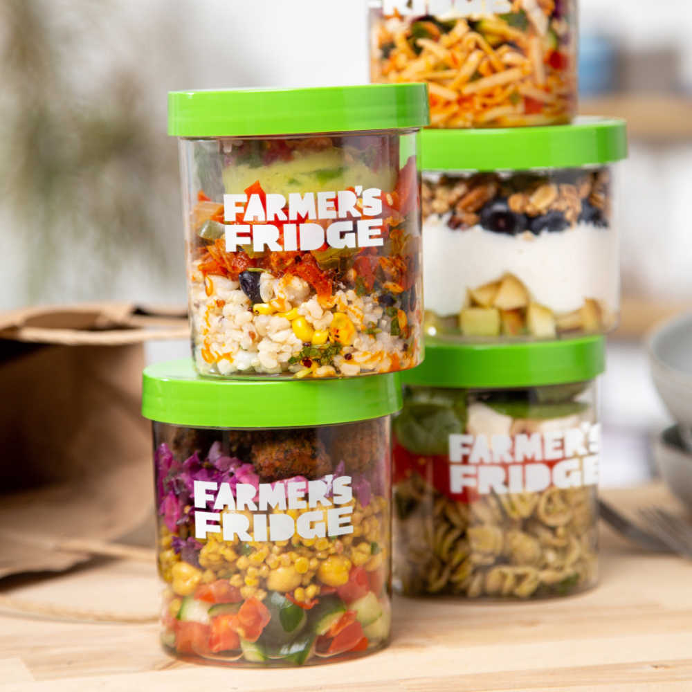 Multiple bowl meals in Jars stacked on top of each other. 