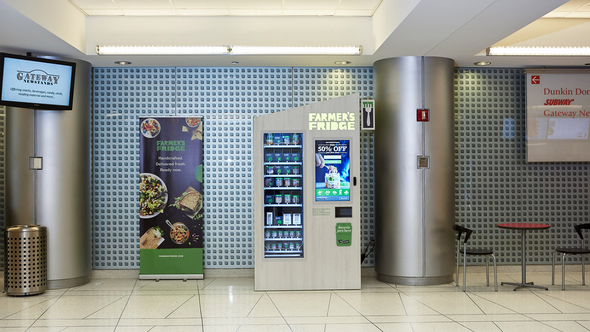 Image of a Farmer's Fridge in a metro train terminal hallway.