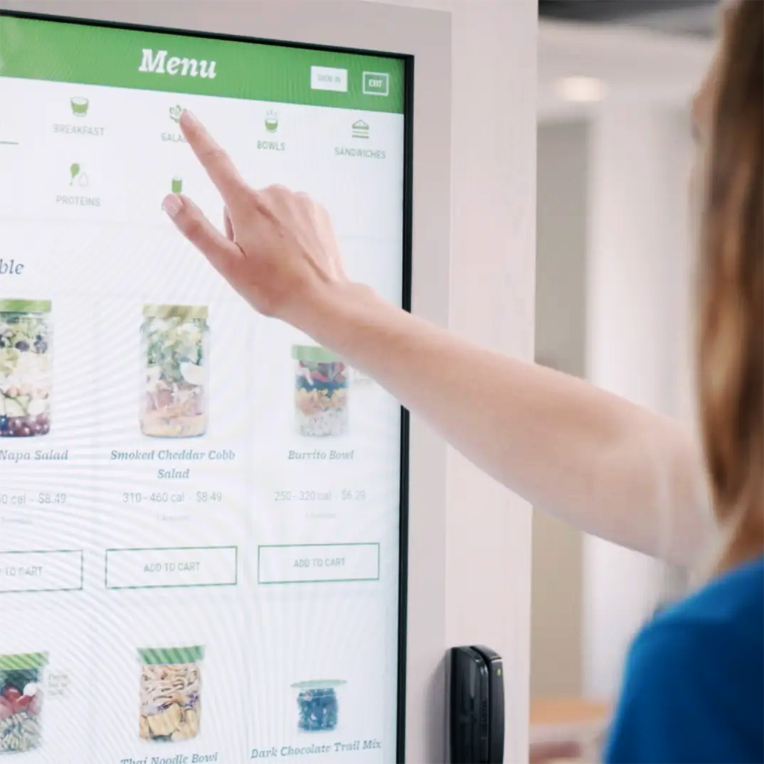Image of a women using a Farmer's Fridge.