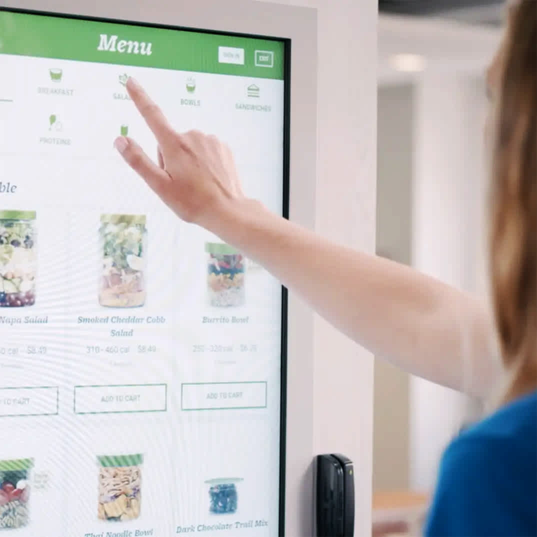 Image of a women using a Farmer's Fridge.