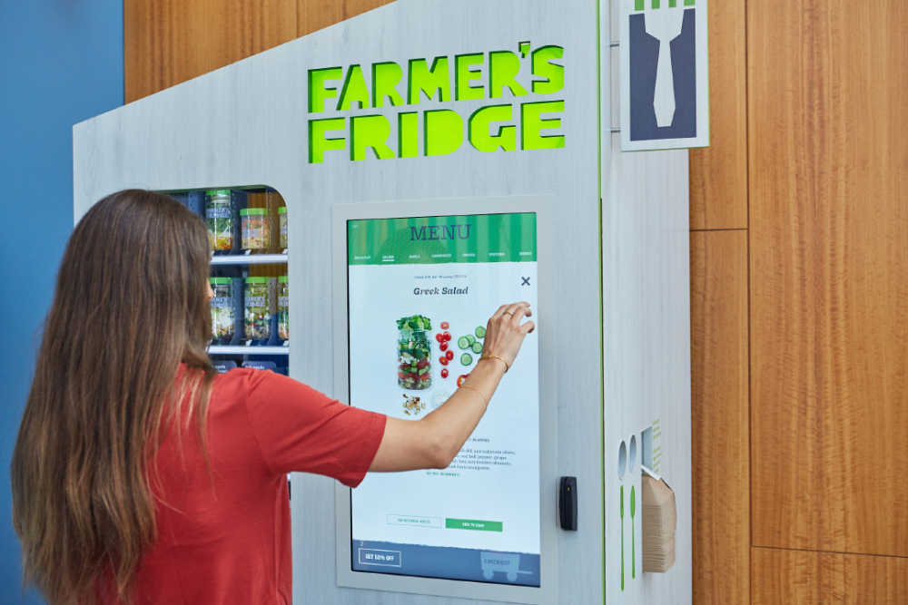 Woman using Farmer's Fridge