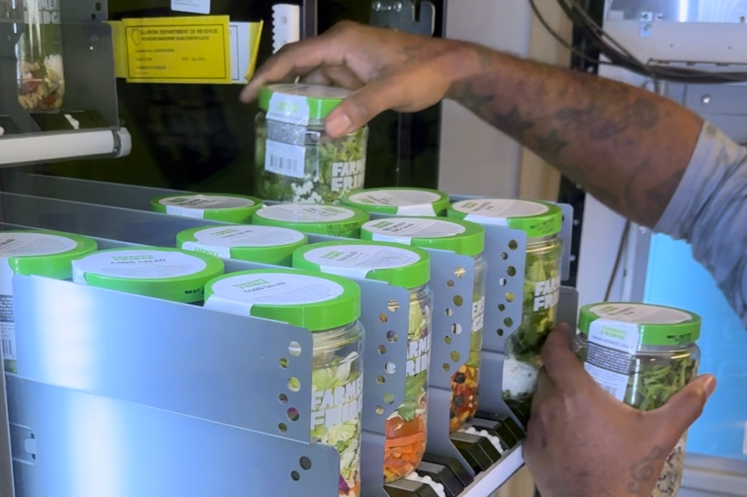 Salads being restocked at a Farmer's Fridge.