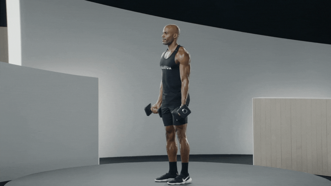 Adrian Williams demonstrates a bicep curl, a beginner arm workout exercise
