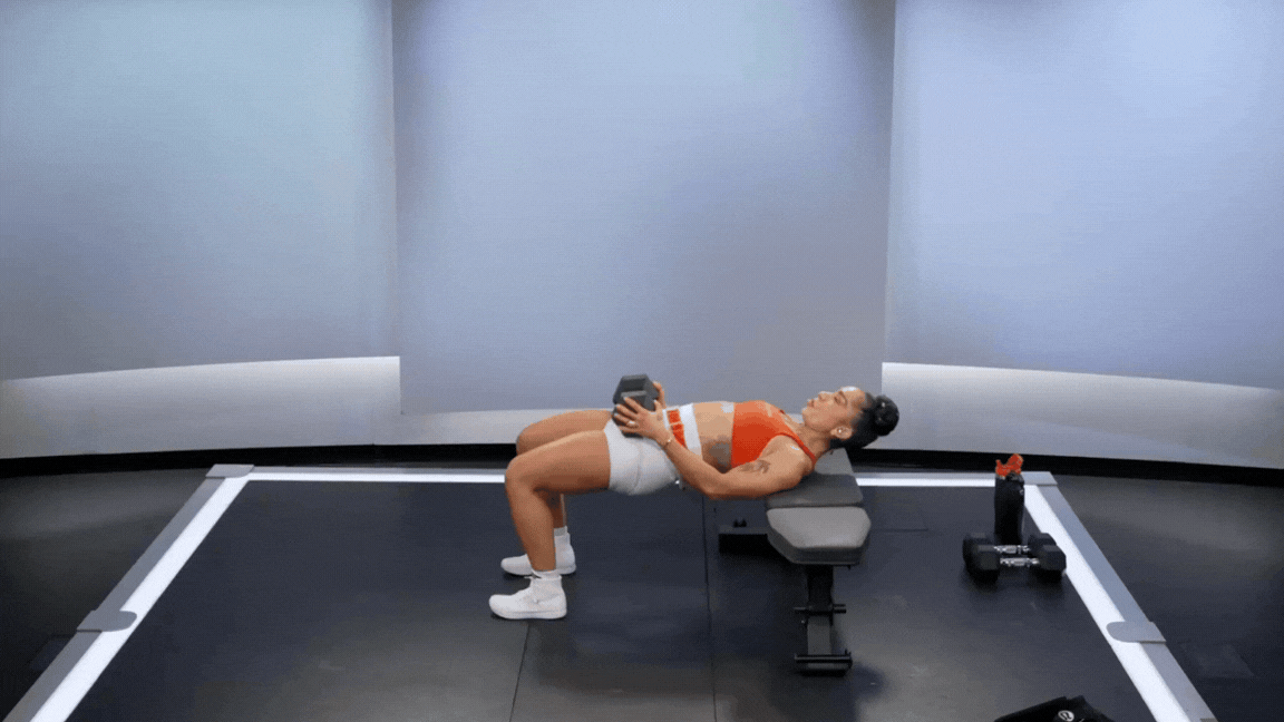 Peloton instructor Robin Arzón demonstrates a hip thrust dumbbell leg exercise.