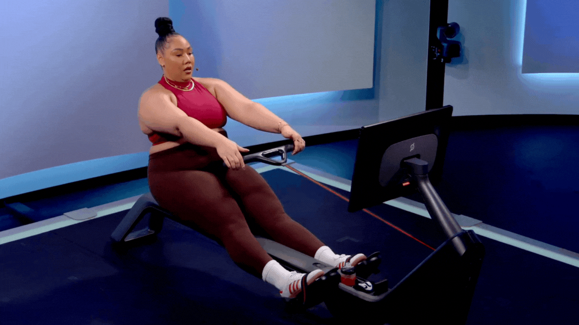 Peloton instructor Ash Pryor demonstrates the finish phase of the rowing stroke on the Peloton Row.