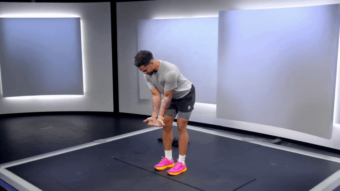 Peloton instructor Rad Lopez demonstrates a bodyweight reverse fly