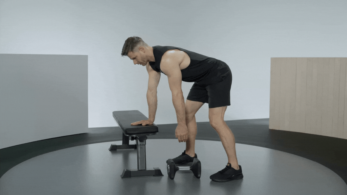 Andy Speer demonstrates a 3-point row exercise with workout bench