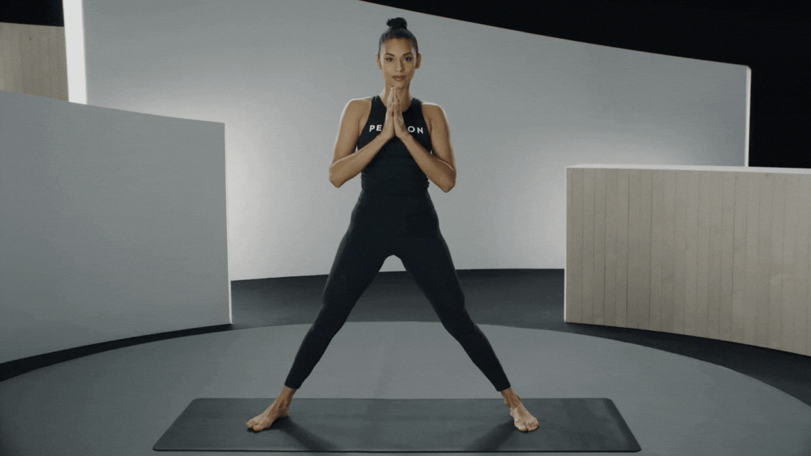 Peloton instructor Aditi Shah demonstrates Side Lunge Pose as part of a pre-run yoga sequence