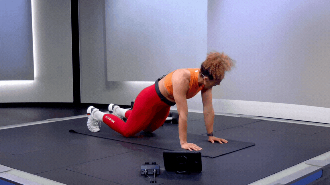 Peloton instructor Jess Sims demonstrates a knee push-up as part of a strength training routine for basketball players