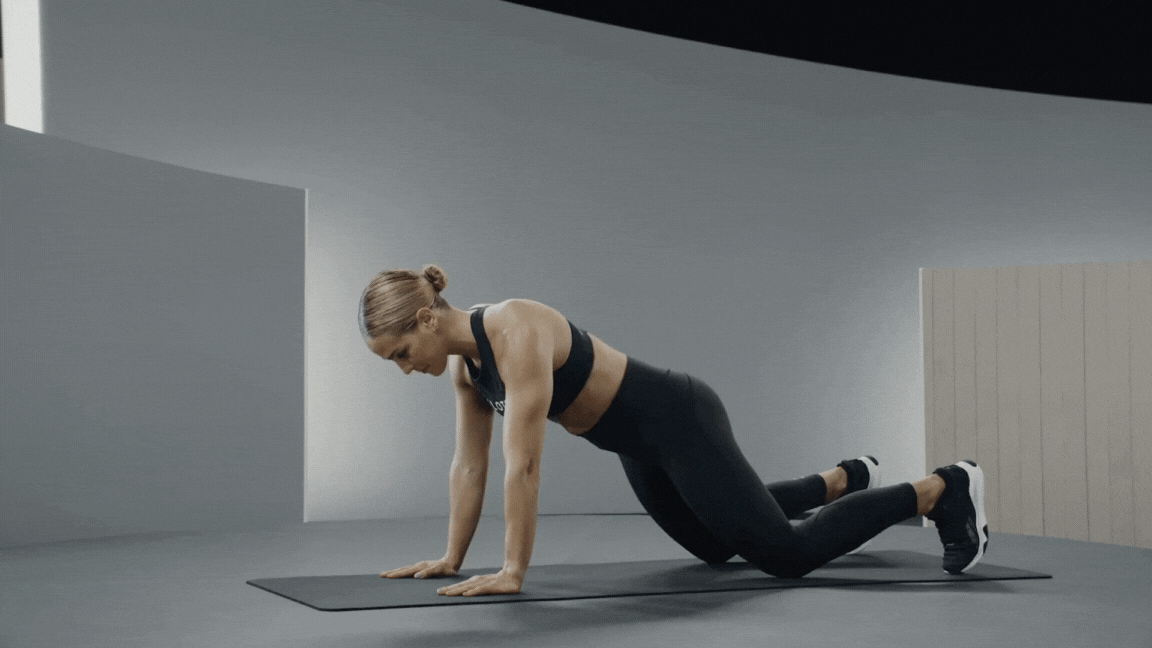 Peloton instructor Jess Sims demonstrates a plank shoulder tap exercise for pickleball.