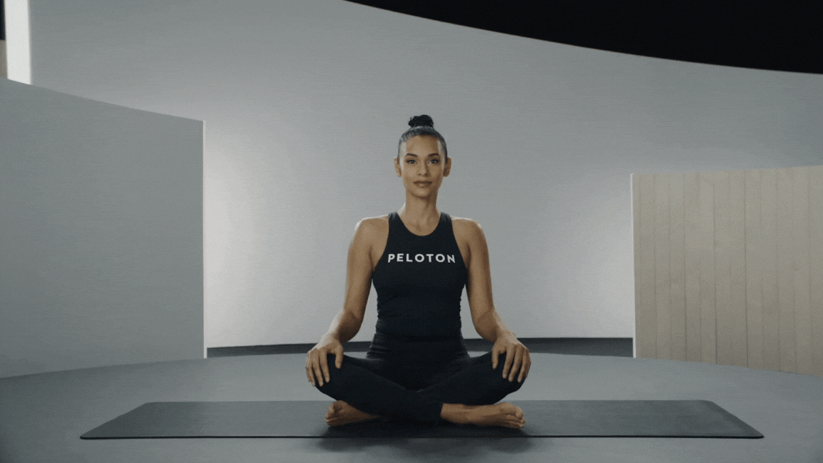Peloton instructor Aditi Shah demonstrates Easy Seated Twist in yoga for core strength