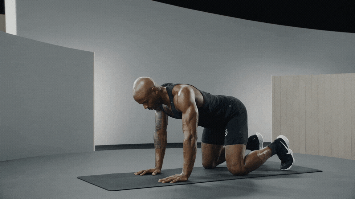 Peloton instructor Adrian Williams demonstrates Floating Tabletop Pose for core strength