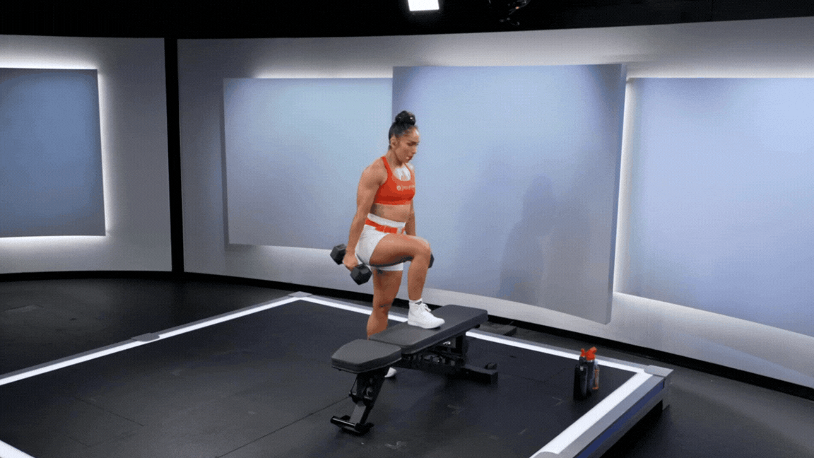 Peloton instructor Robin Arzón demonstrates a weighted step up dumbbell leg exercise.
