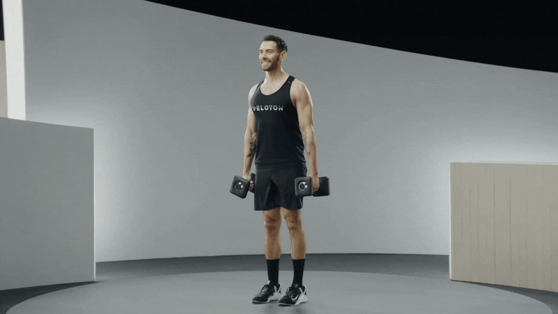 Peloton instructor Matty Maggiacomo doing dumbbell march exercise