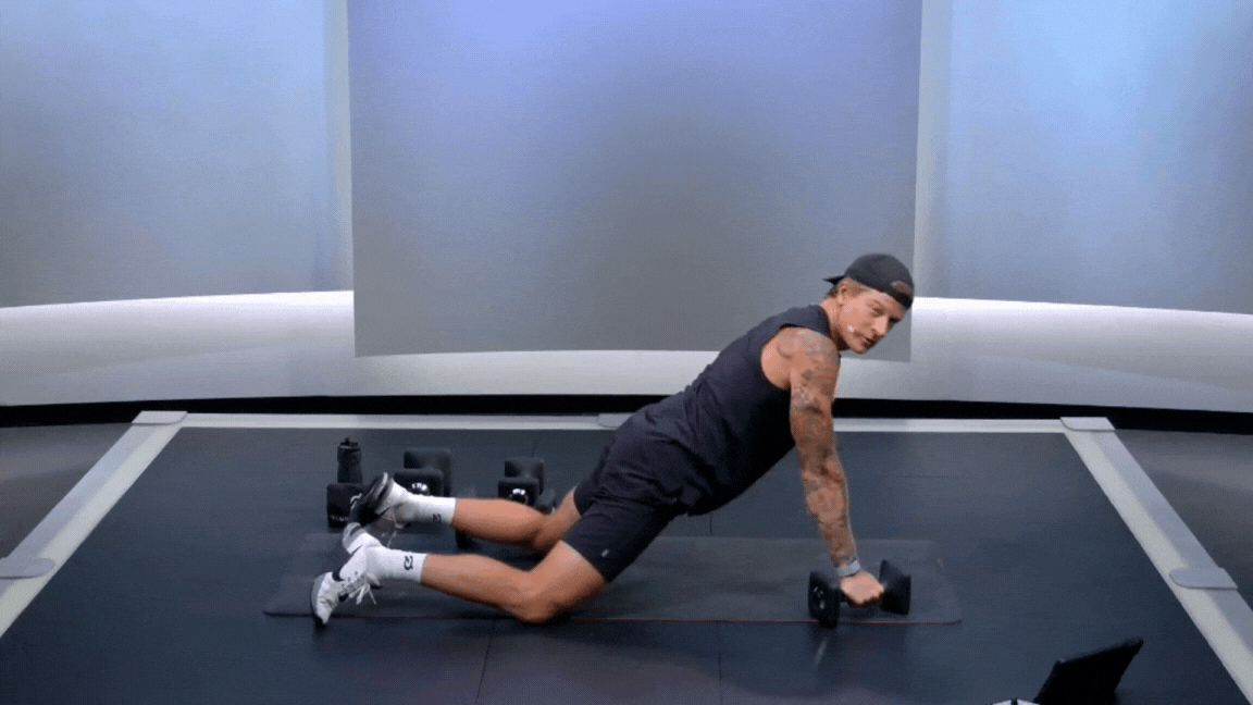 Logan Aldridge doing pushups in Peloton class GIF