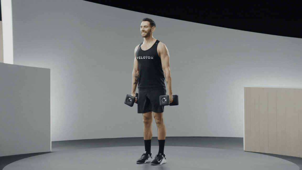 Peloton instructor Matty Maggiacomo demonstrates a marching farmer's carry with proper form