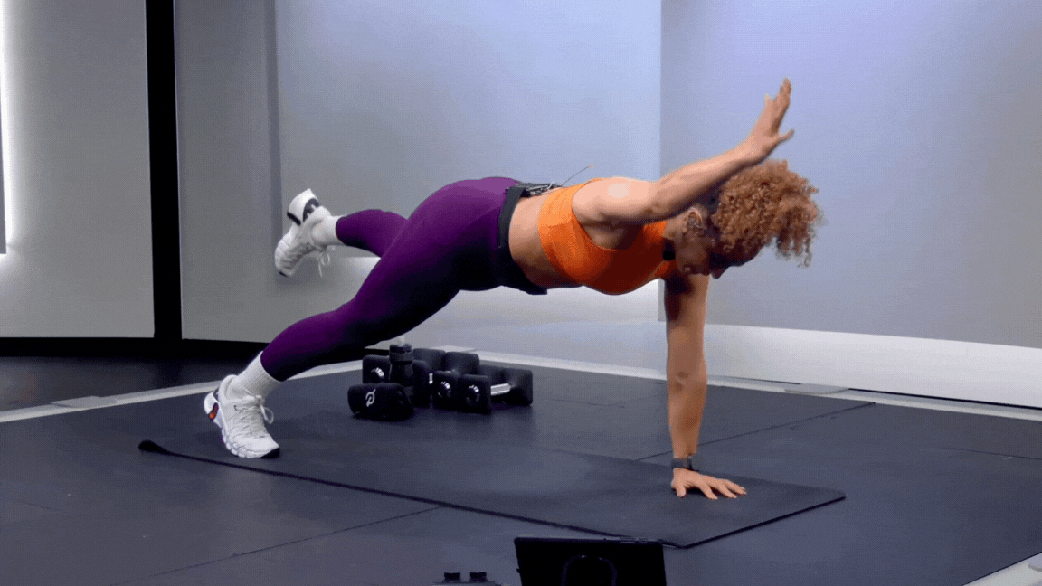 Peloton instructor Jess Sims demonstrates a plank bird dog as part of a strength training routine for basketball