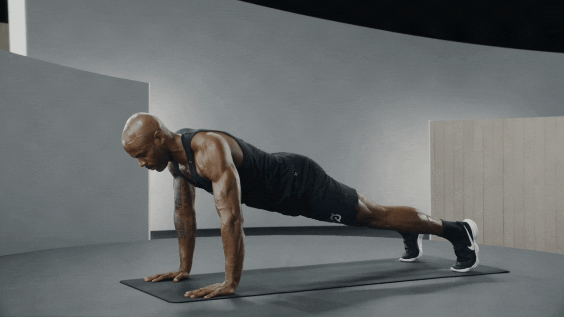 Peloton instructor Adrian Williams demonstrates push-ups with proper form