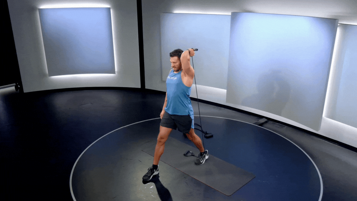 Peloton instructor Matty Maggiacomo demonstrates a triceps extension resistance band exercise.