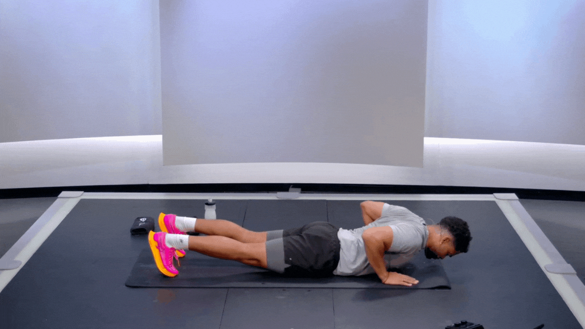 Peloton instructor Rad Lopez demonstrates a hand release push-up bodyweight exercise with proper form