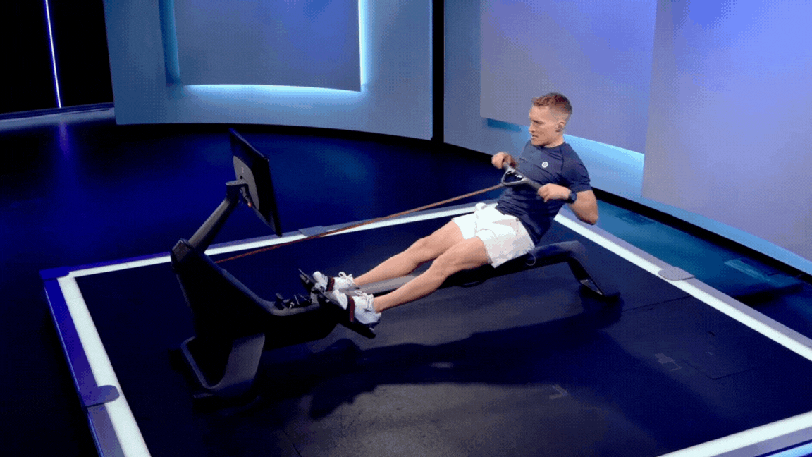 Peloton instructor Matt Wilpers demonstrates the recovery phase of the rowing stroke on a Peloton Row.