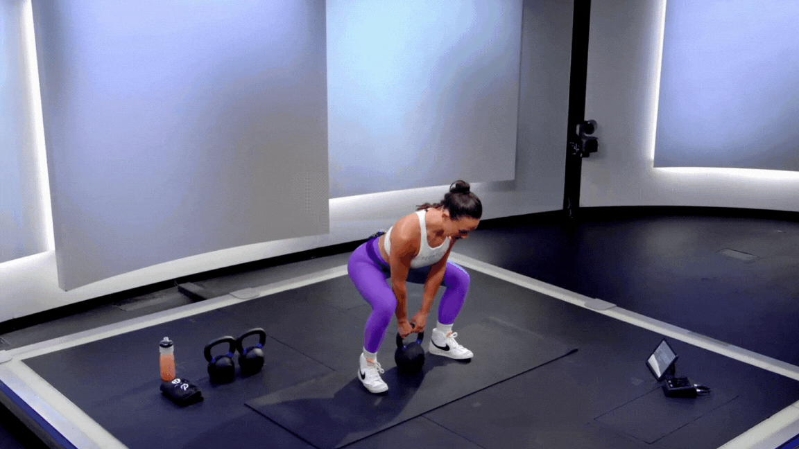 Peloton instructor Katie Wang demonstrates a kettlebell dead clean back exercise.