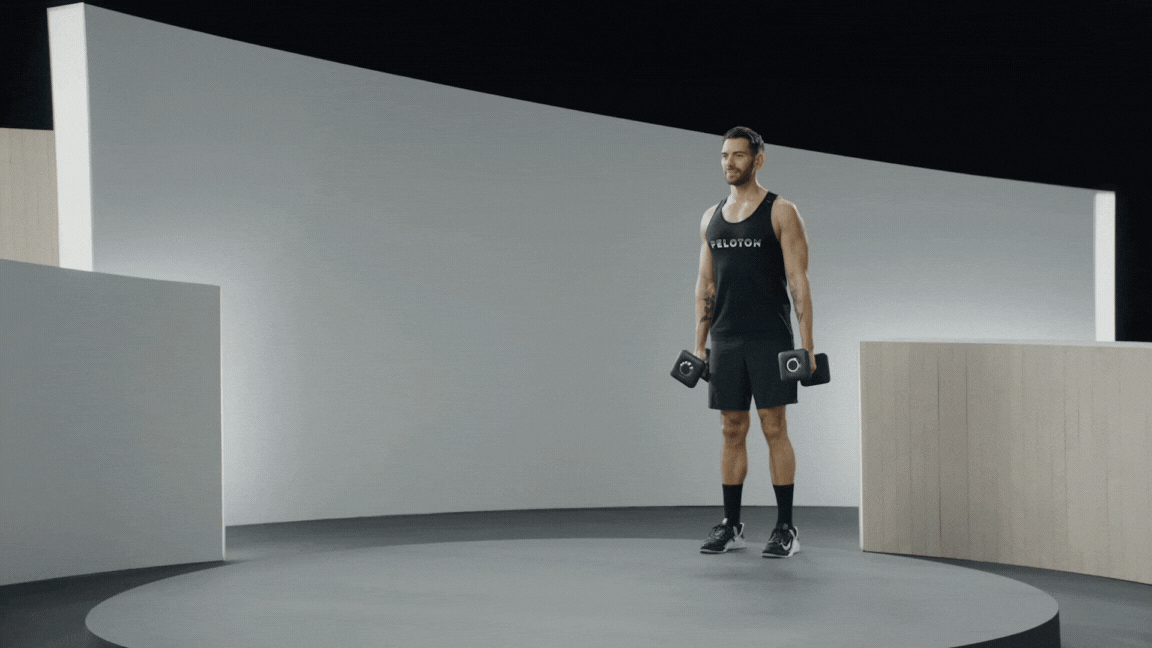 Peloton instructor Matty Maggiacomo demonstrates a farmer's carry core exercise for runners.