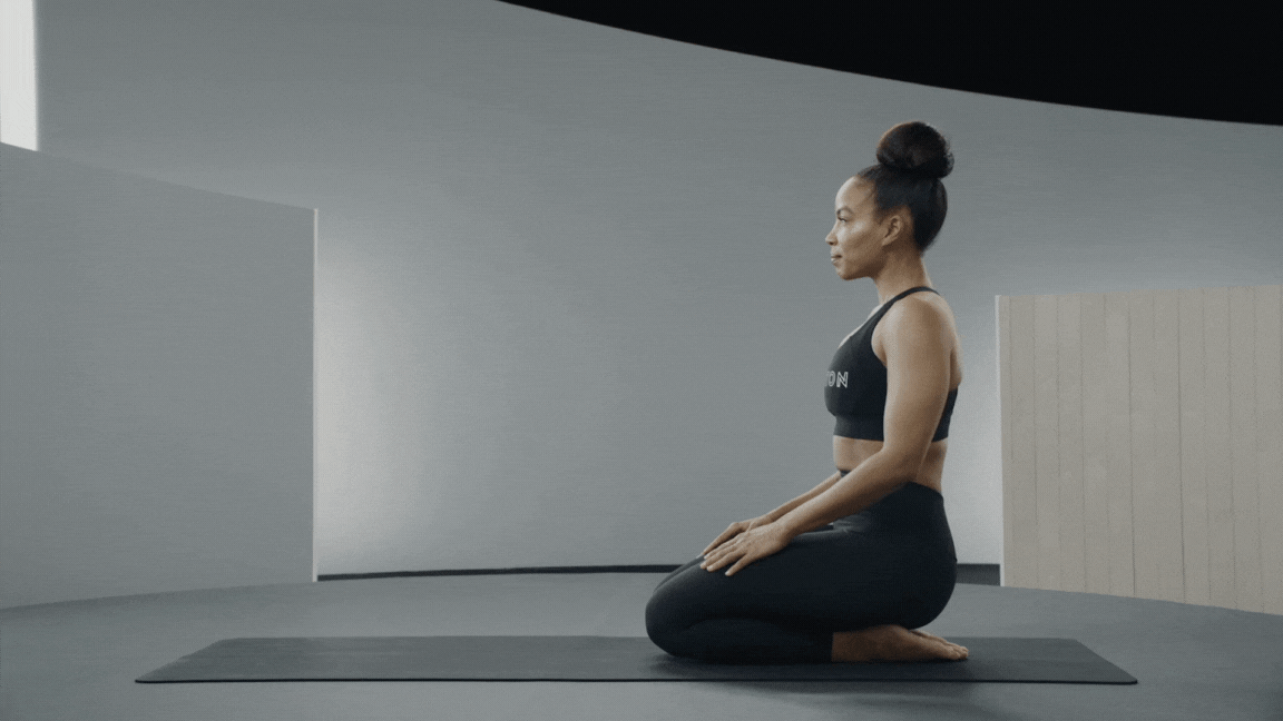Peloton instructor Chelsea Jackson Roberts demonstrates Downward-Facing Dog as an easy yoga pose.