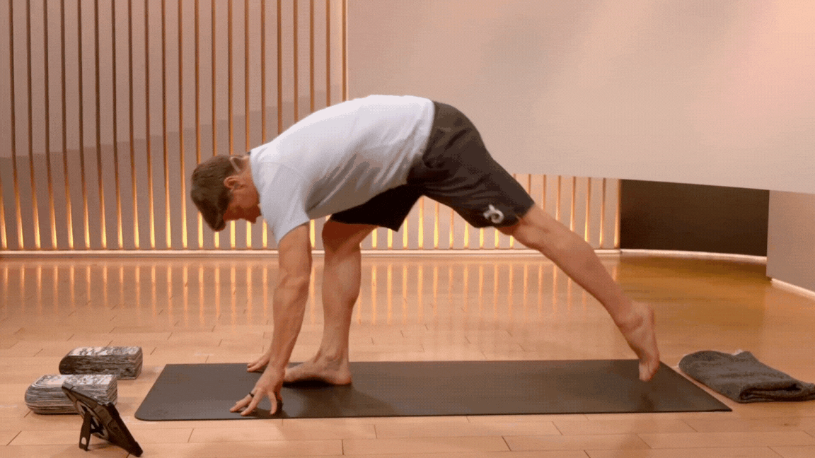 Peloton instructor Denis Morton demonstrates a low lunge pose for the lower back during a Peloton yoga class.
